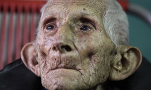 Ignacio Cubilla Banos sits in his house during his 111th birthday celebration in Havana